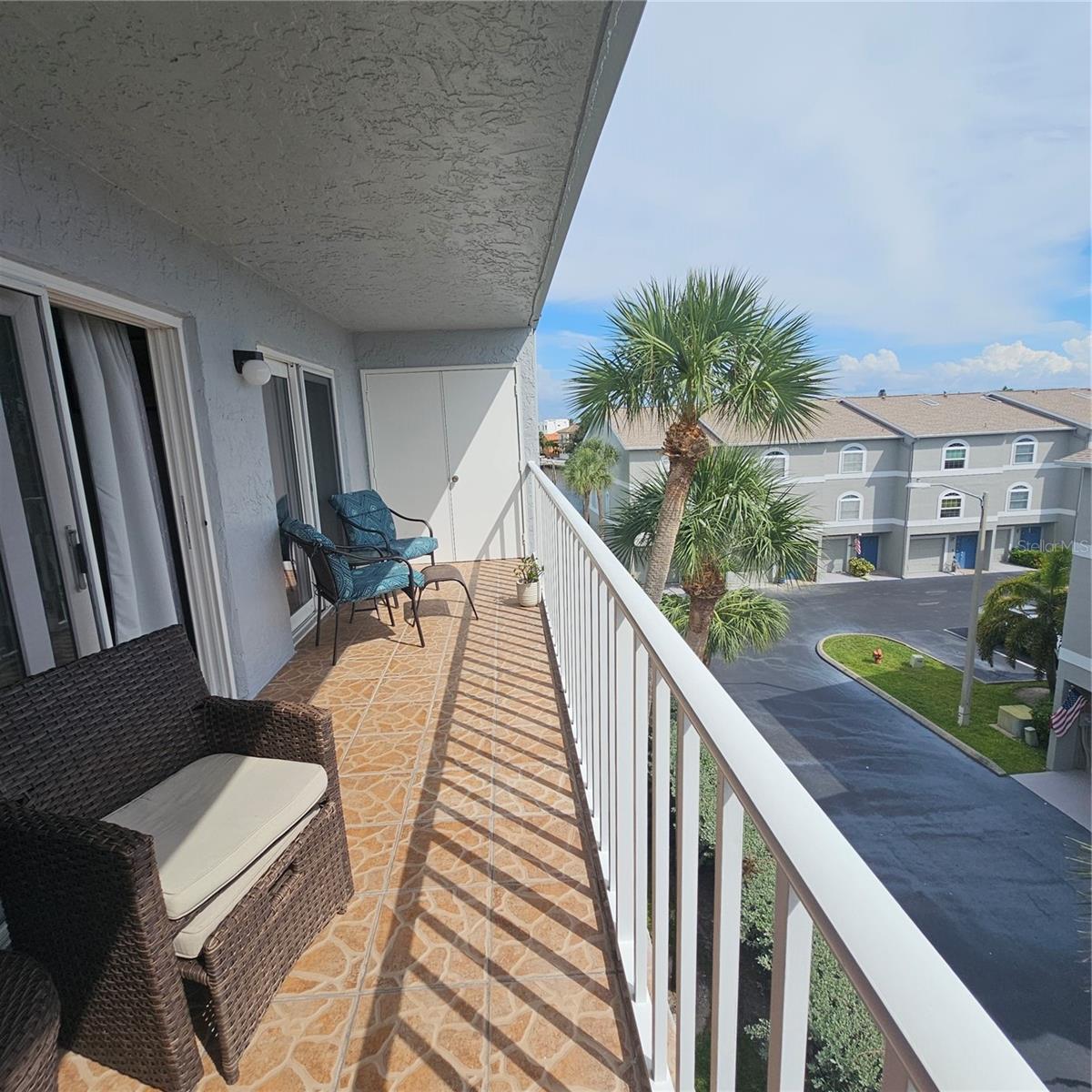 View toward the west. The washer & Dryer is located at the end of the porch area.