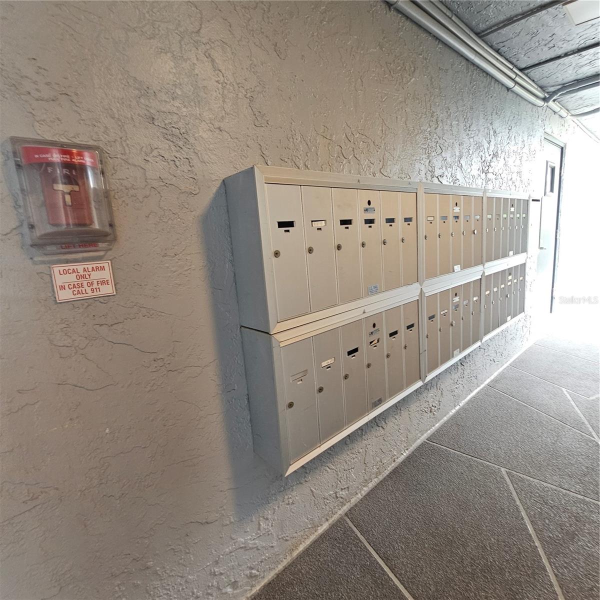 Mailbox is near the elevator.