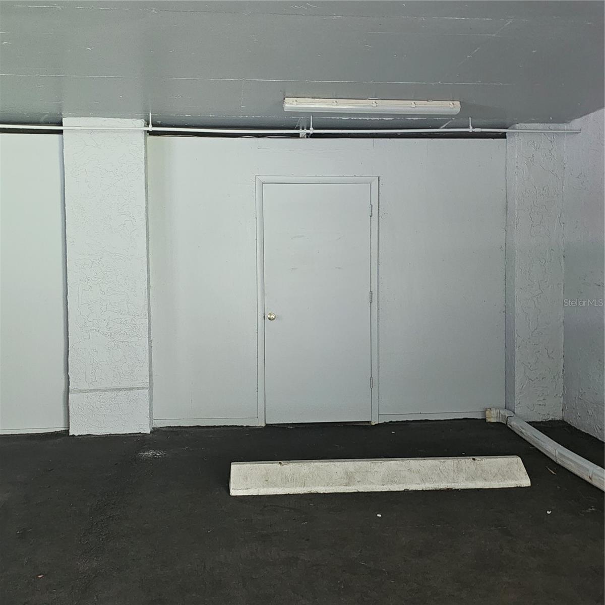 Storage unit door to storage units for each owner. This is a locked door & locks on the inside unit.