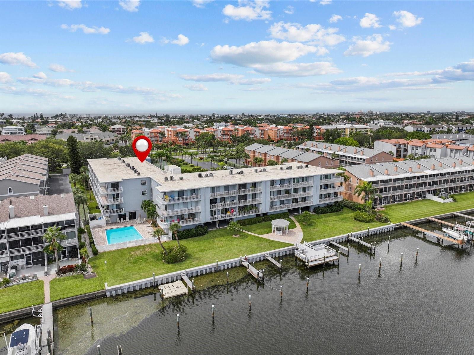 From the water side view. Boat slips, dock, gazebo and pool!