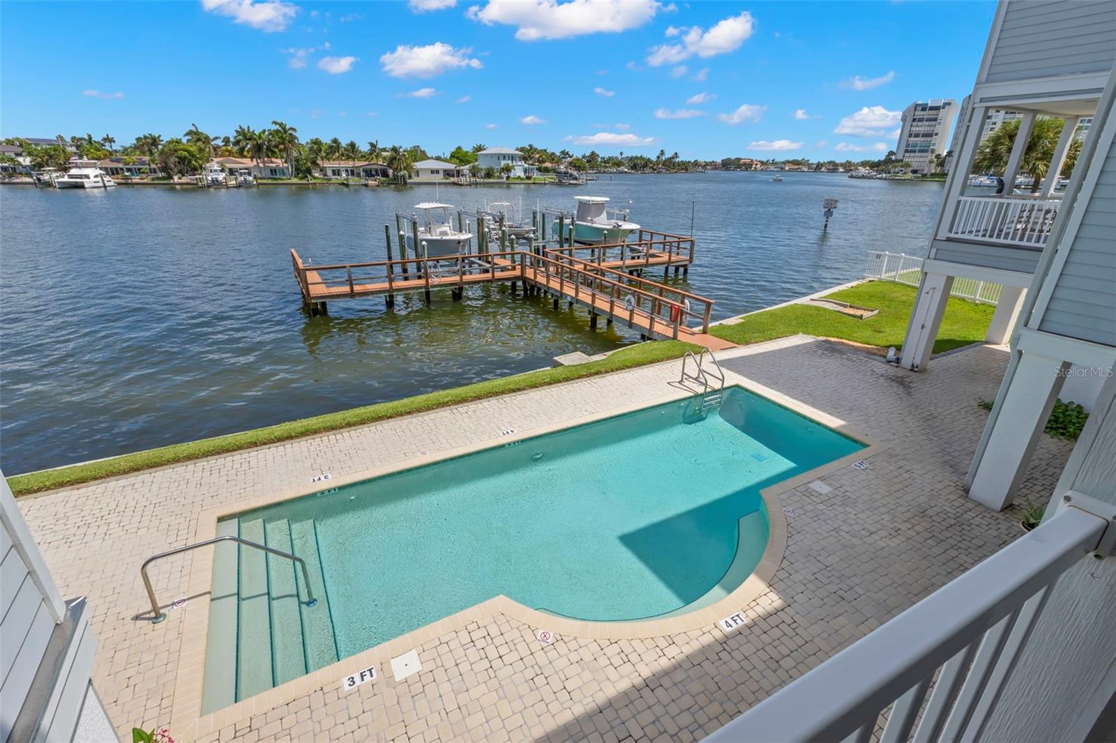 Cool off and enjoy the sunshine with this poolside paradise right outside your living room. With views of the Intracoastal Waterway and your own deeded boat slip, it's the ultimate spot for relaxation or fun in the sun!