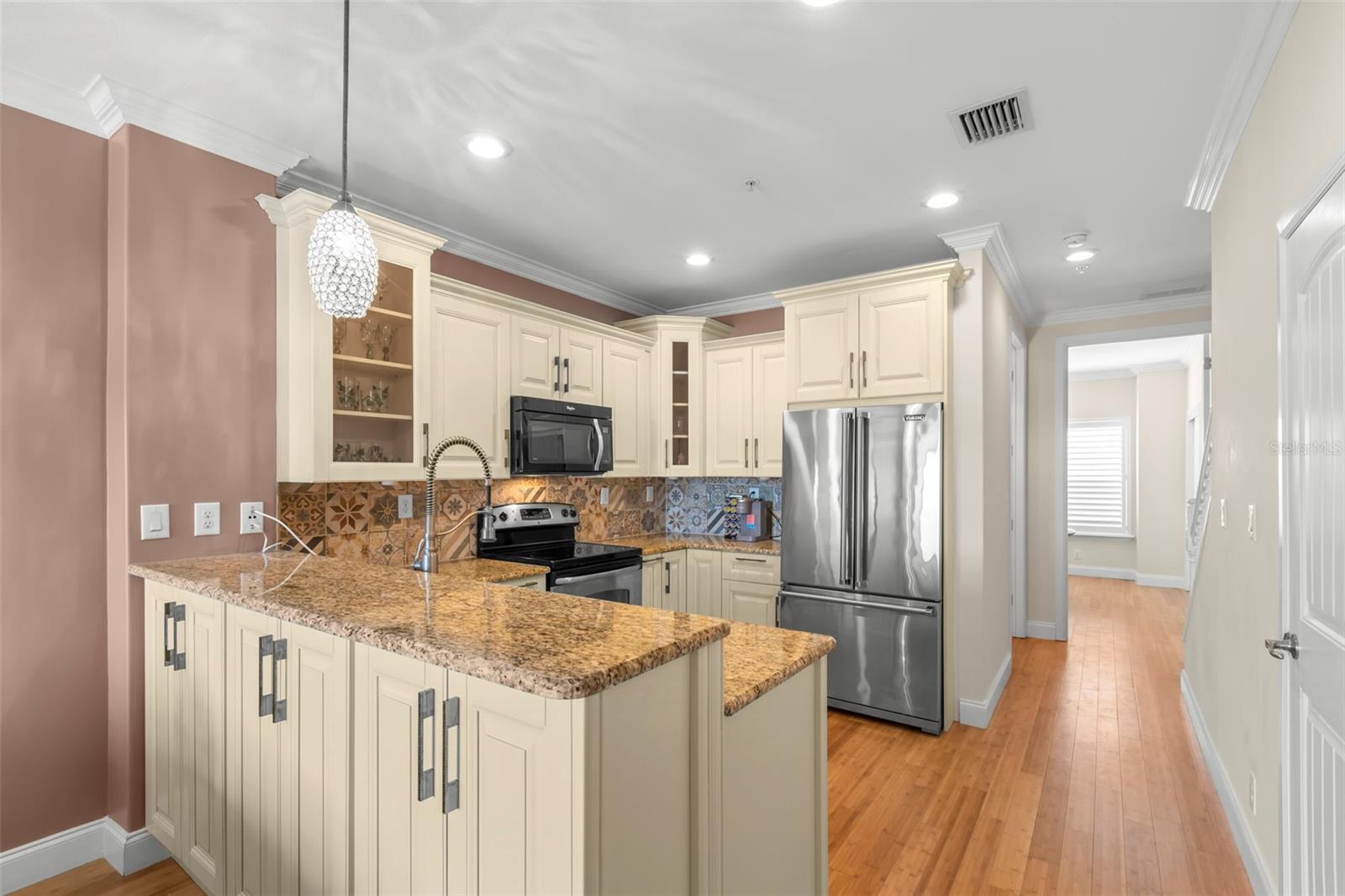 Get ready to unleash your inner chef! This beautifully updated kitchen features custom cabinetry, a sleek granite countertop, and stainless steel Viking appliances, making it both functional and fabulous.