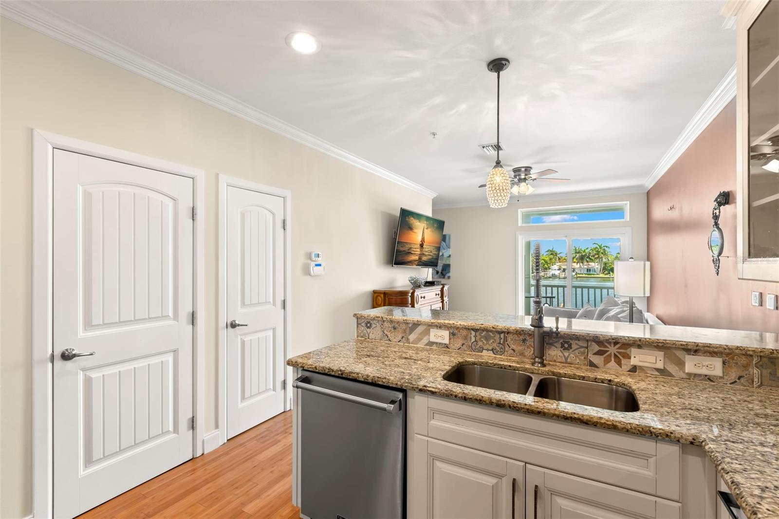 From the kitchen sink to the stunning view—this open layout lets you stay connected with guests in the living area and keep an eye on the beautiful water just beyond your balcony.