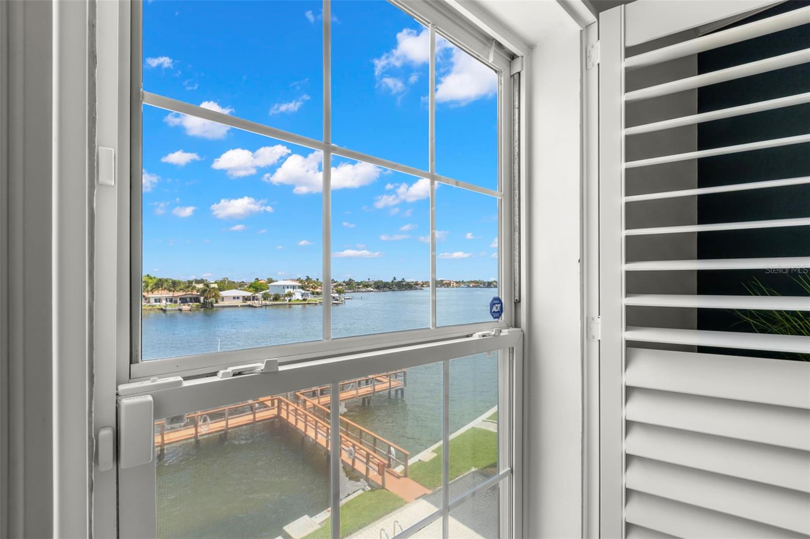 Wake up to this stunning waterfront view right from your bedroom window—because every day should start with a little inspiration.