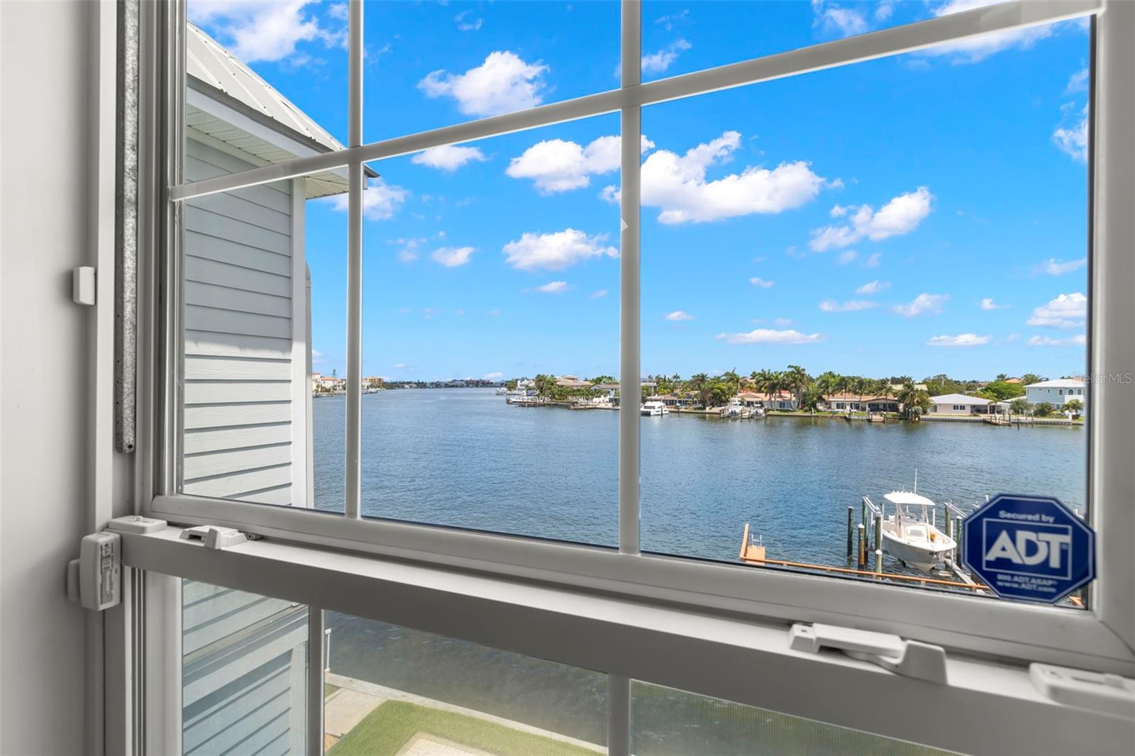 From sunrise to sunset, this northeast-facing view from your bedroom window promises tranquility and a front-row seat to the natural beauty of the water.