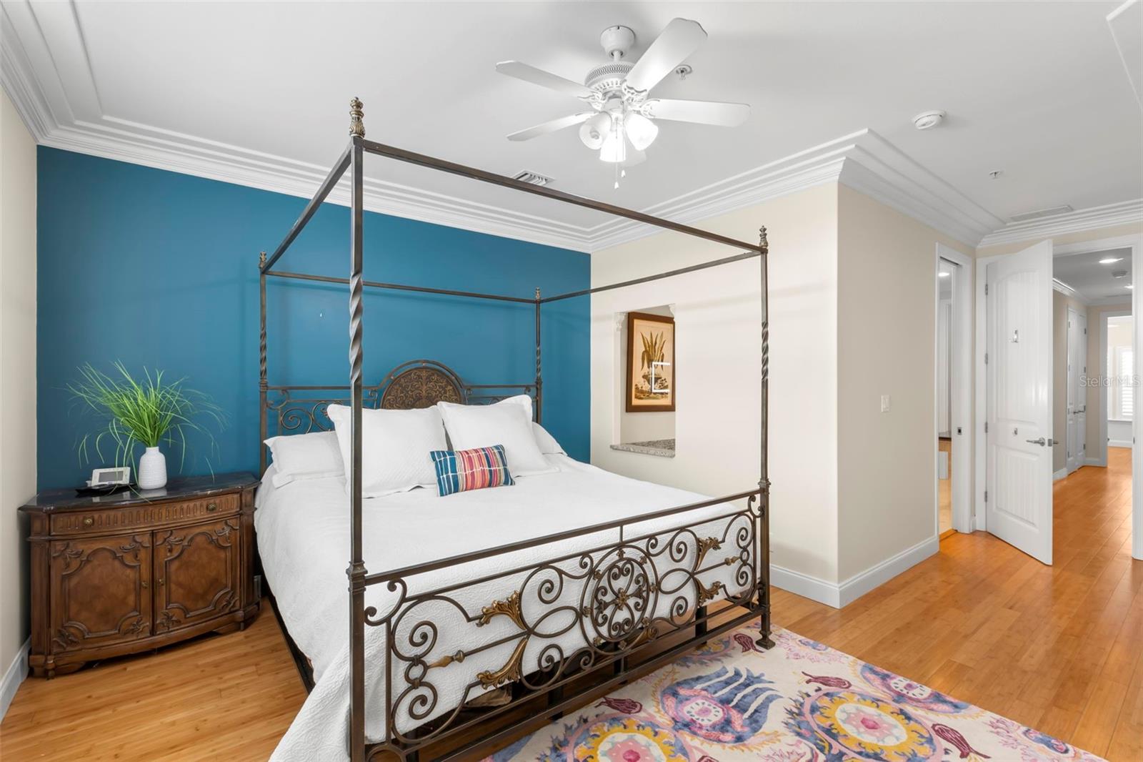 Unwind in style in this cozy and inviting primary bedroom, where classic elegance meets modern comfort. Perfect for starting and ending your day.