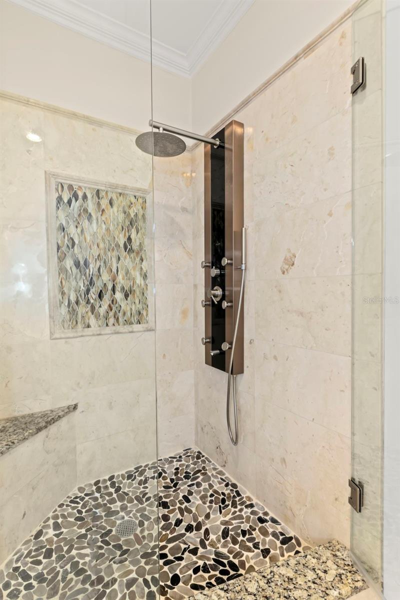 Close-up of custom step-in shower.