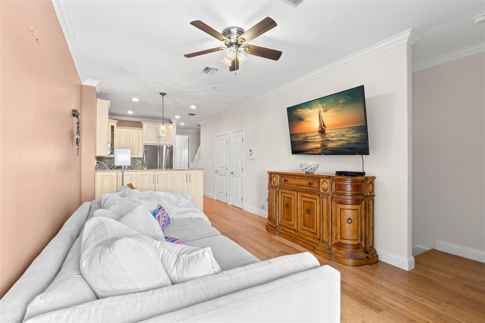 Settle in for a movie night or unwind after a long day in this bright and airy living room, perfectly set up for relaxation and conversation. The open floor plan keeps everything connected!