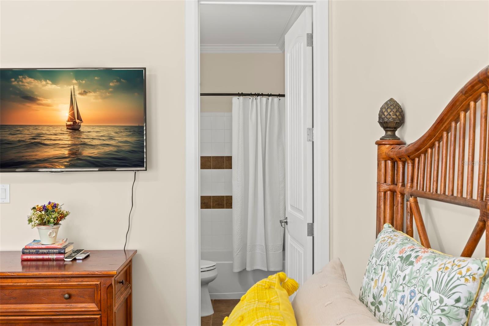 Guest bedroom featuring a cozy ensuite bathroom, ensuring privacy and convenience for visitors.