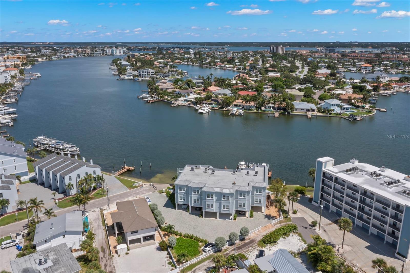 Breathtaking aerial view of the serene waterfront community, showcasing the ideal location and stunning surroundings of this coastal property.