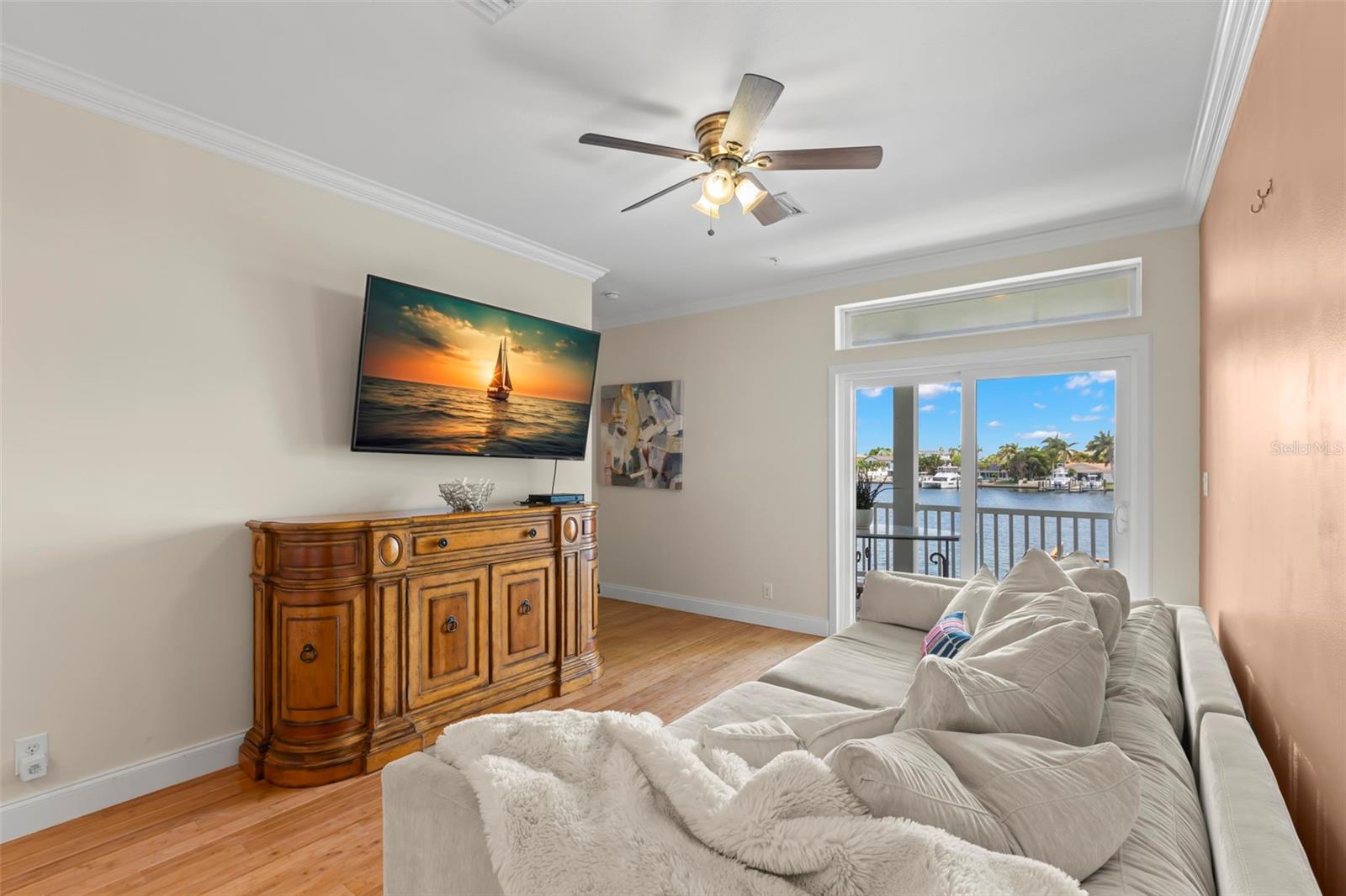 Enjoy the perfect blend of indoor comfort and outdoor beauty. From cozy TV nights to breezy mornings with a view, this living room opens directly onto your private balcony overlooking the water..