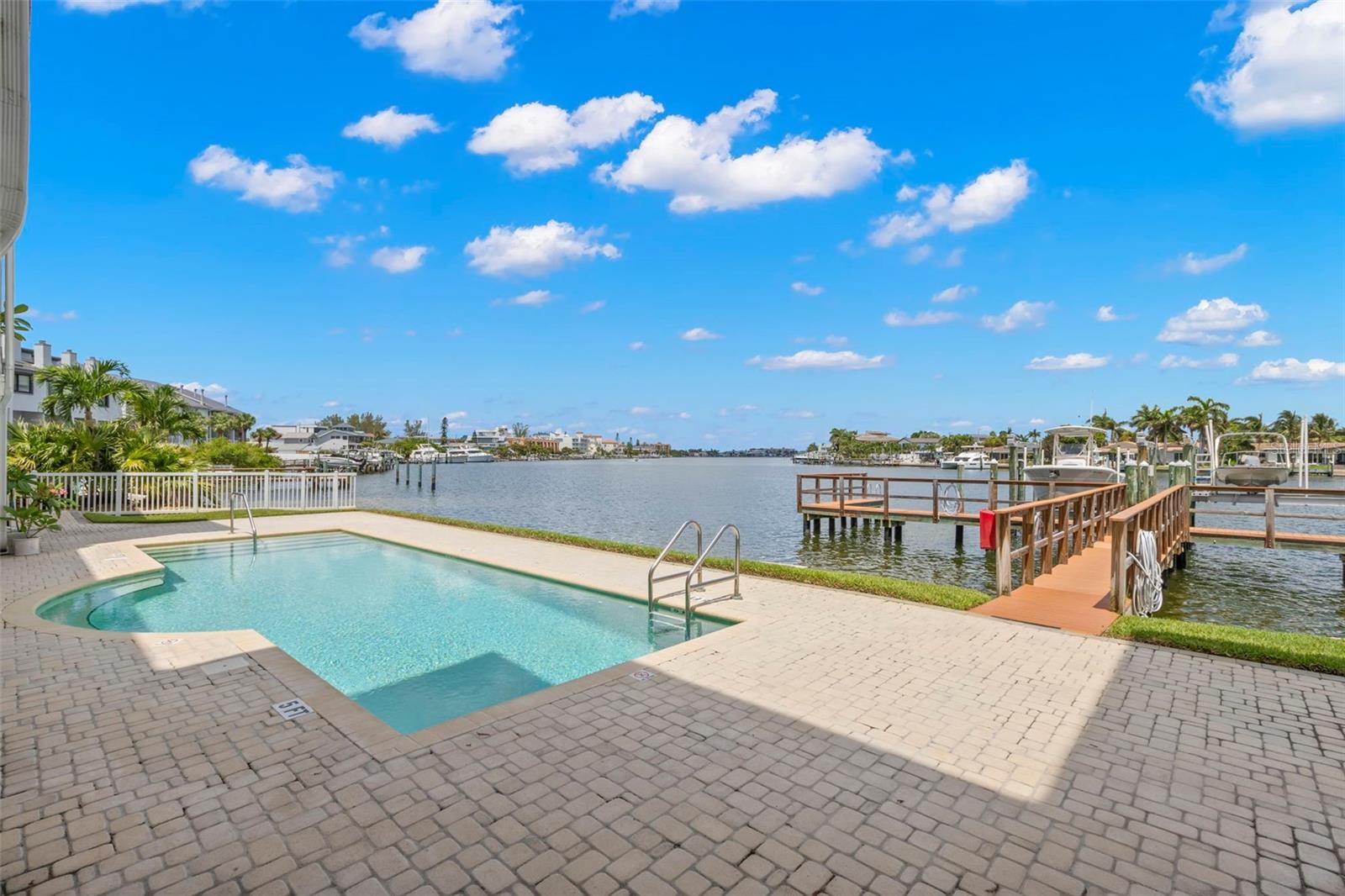 Take a refreshing dip in the pool while admiring your boat slip and the tranquil waters beyond.