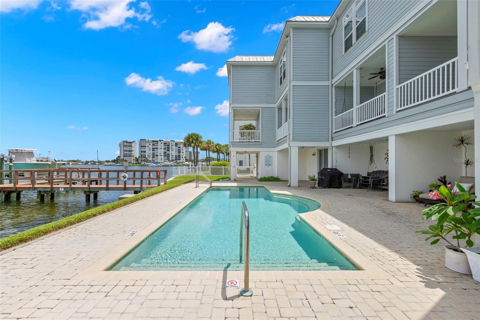 Another view of the rear elevation across the pool.