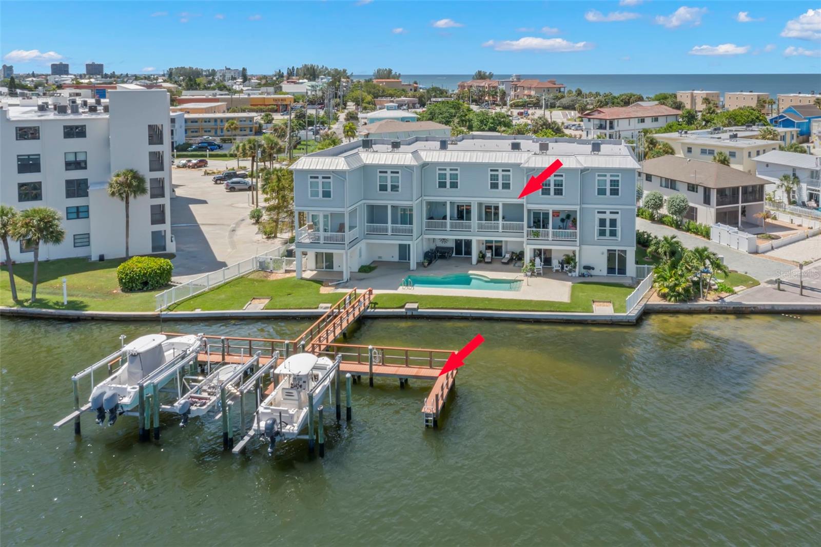 Aerial view of the waterfront location of the townhome, complete with a private boat slip.