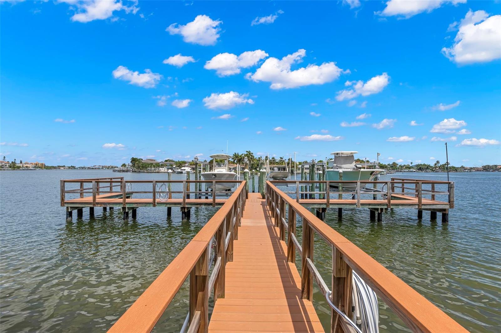 Stroll down the private dock to your boat, ready for an afternoon of cruising and enjoying the waterfront lifestyle.