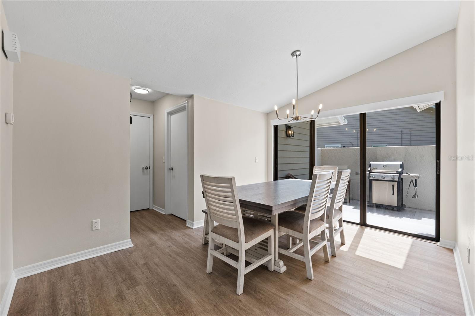 Dining room off of the kitchen with sliders to BBQ Lanai. Short hallway has doors to the laundry room and garage.