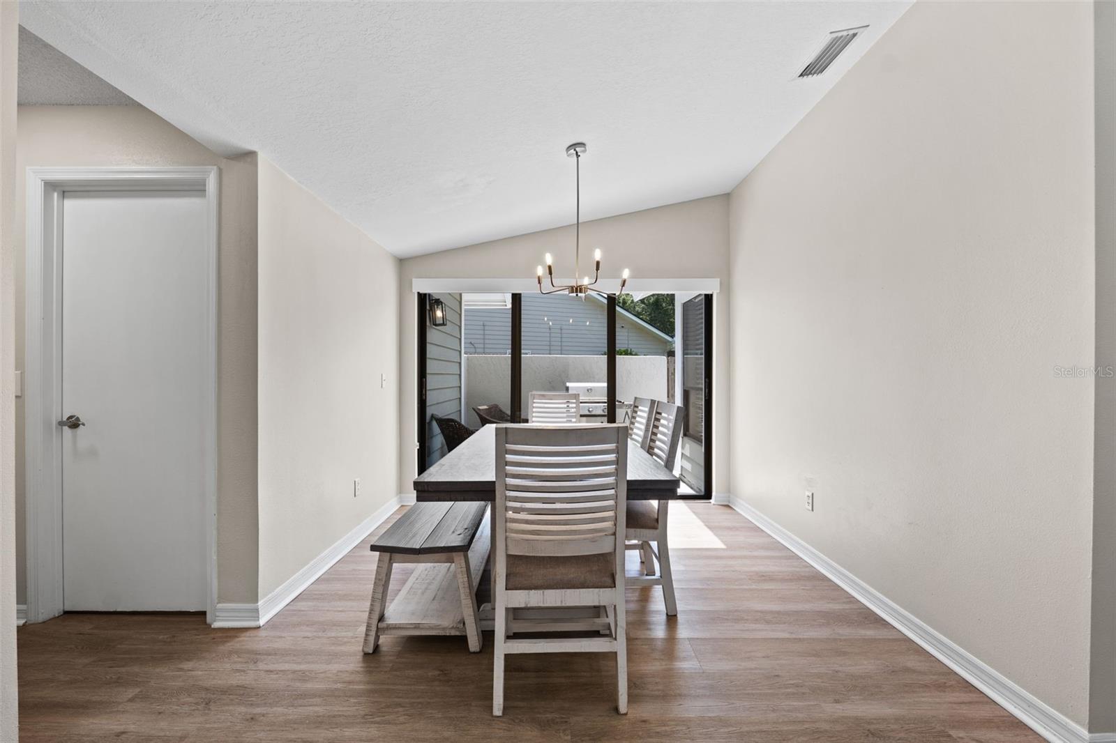 Dining room off of the kitchen with sliders to BBQ Lanai