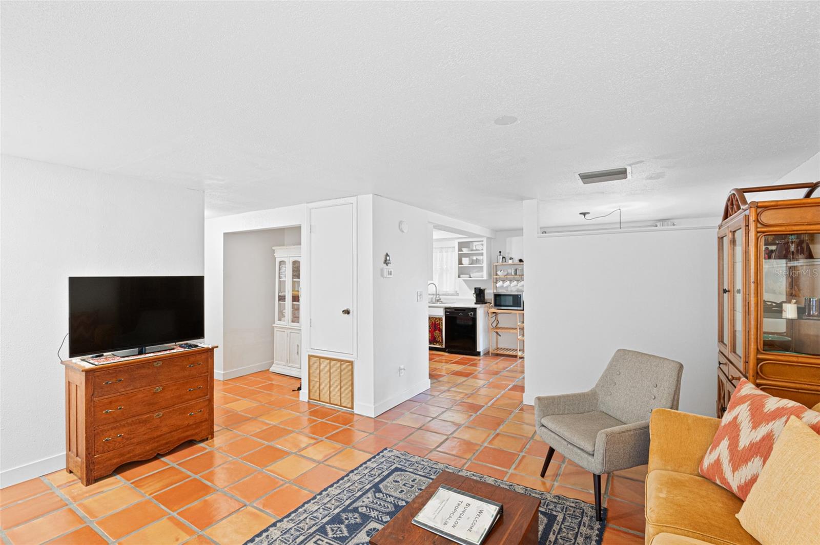 Front entry into the living room that is connected to the kitchen.