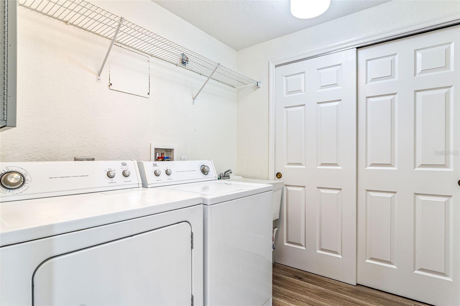 Large laundry room w/sink and storage