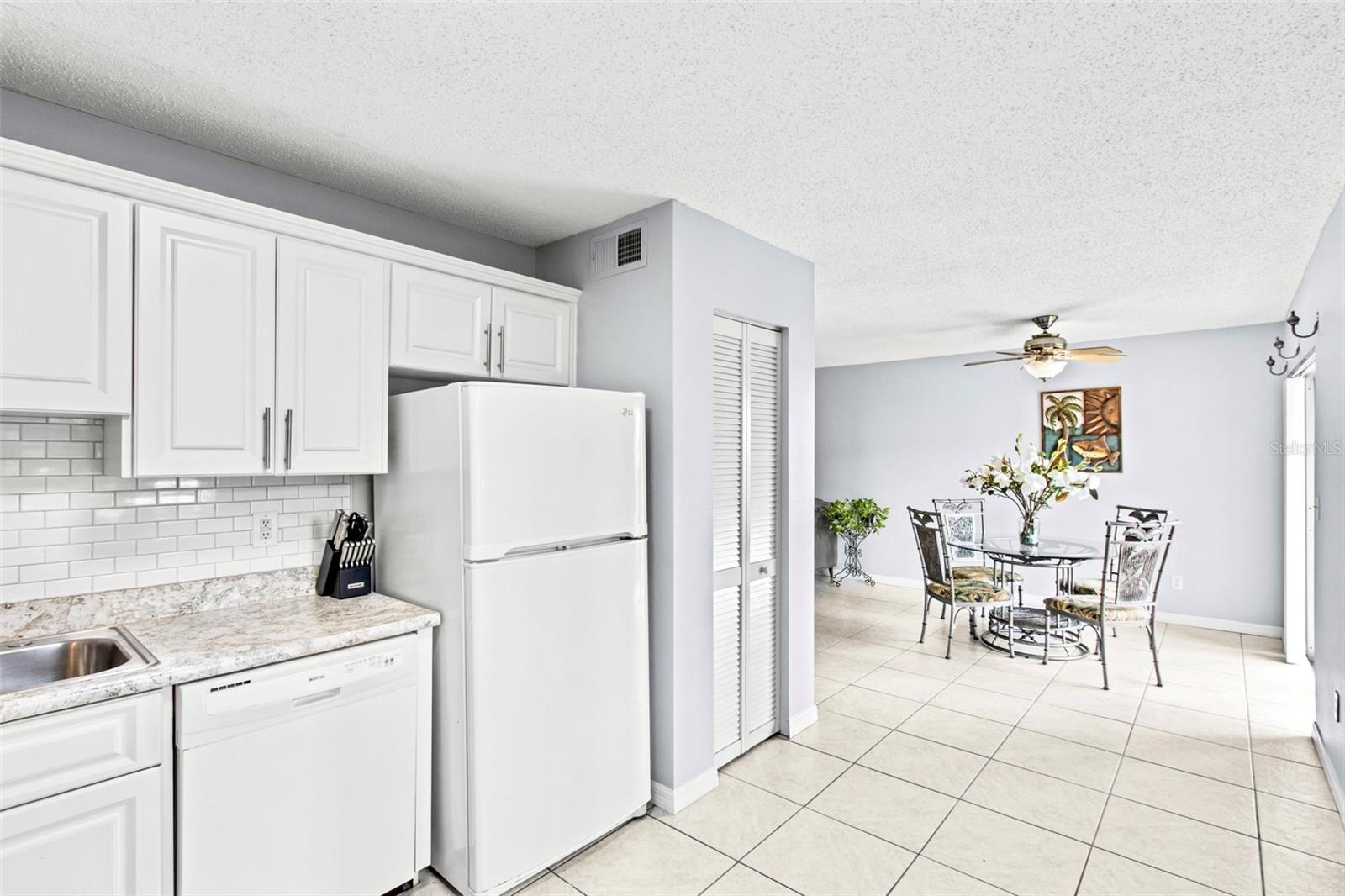 Kitchen opens to dining area.