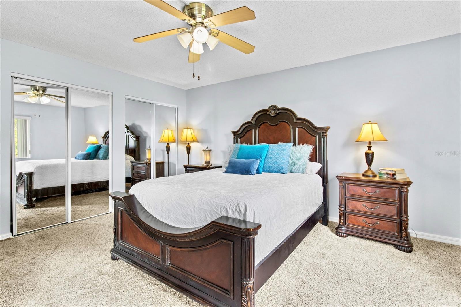 Double linear closet in bedroom offers plenty of storage.