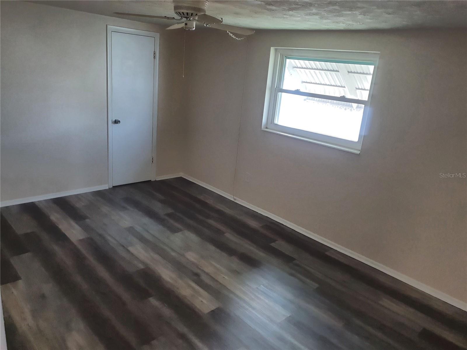 2nd bedroom is across the hallway from the kitchen and guest bathroom