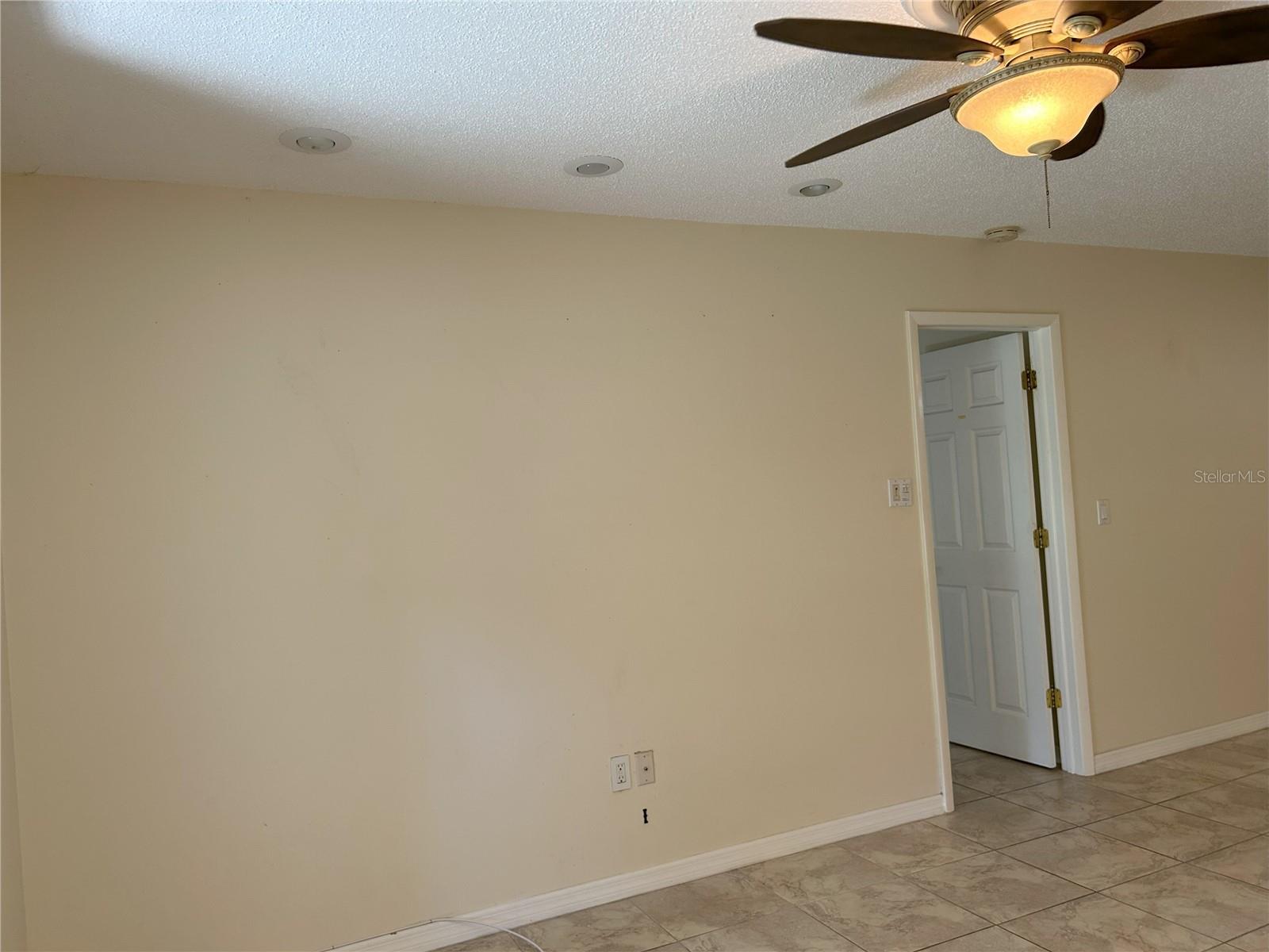 Living Room With Entrance to Owner's Suite