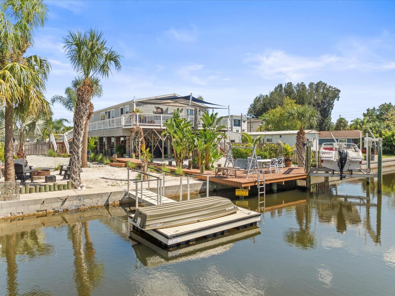 Back View - Firepit Lounge Area, Floating Dock, Stationary Dock, Lift, Wrap-Around Balcony Patio - West Facing