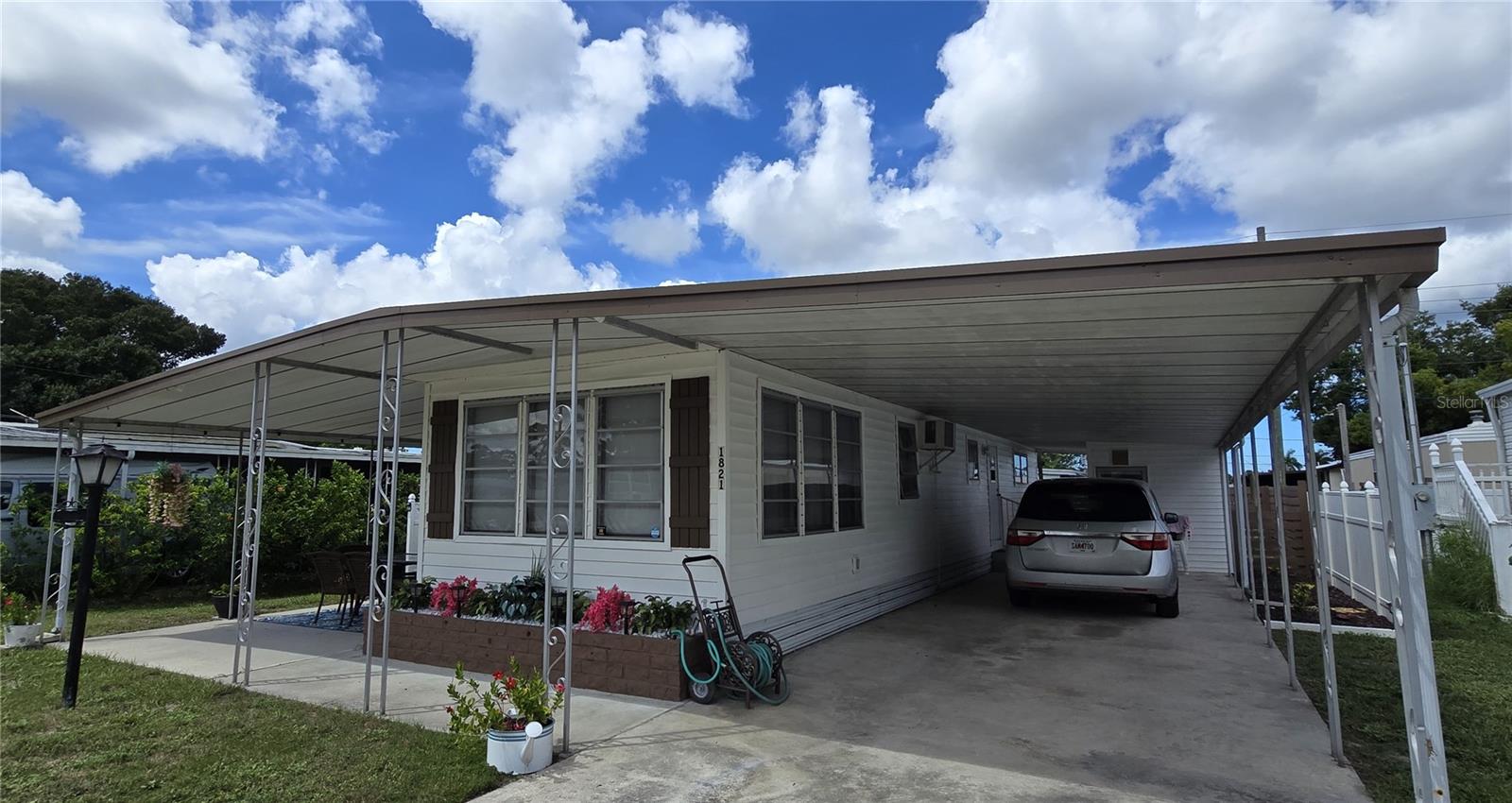 Beautiful Curb appeal!  50ft Carport and covered side porch