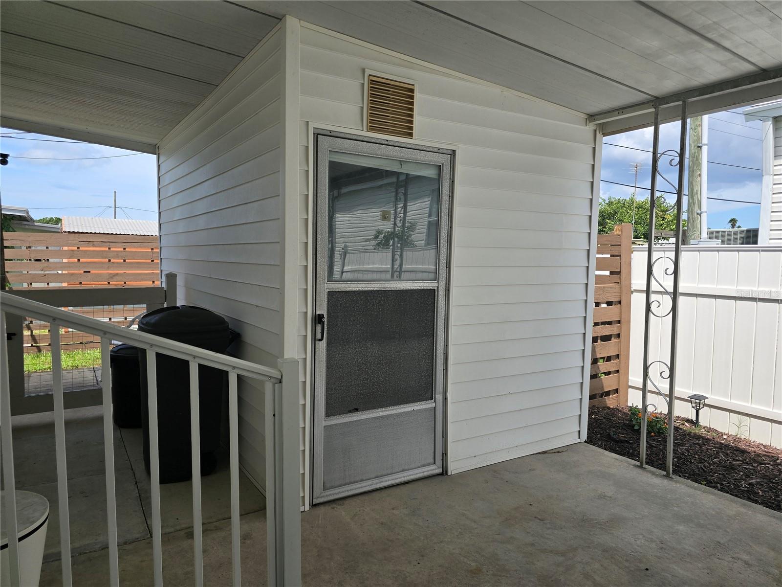 Storage room under carport