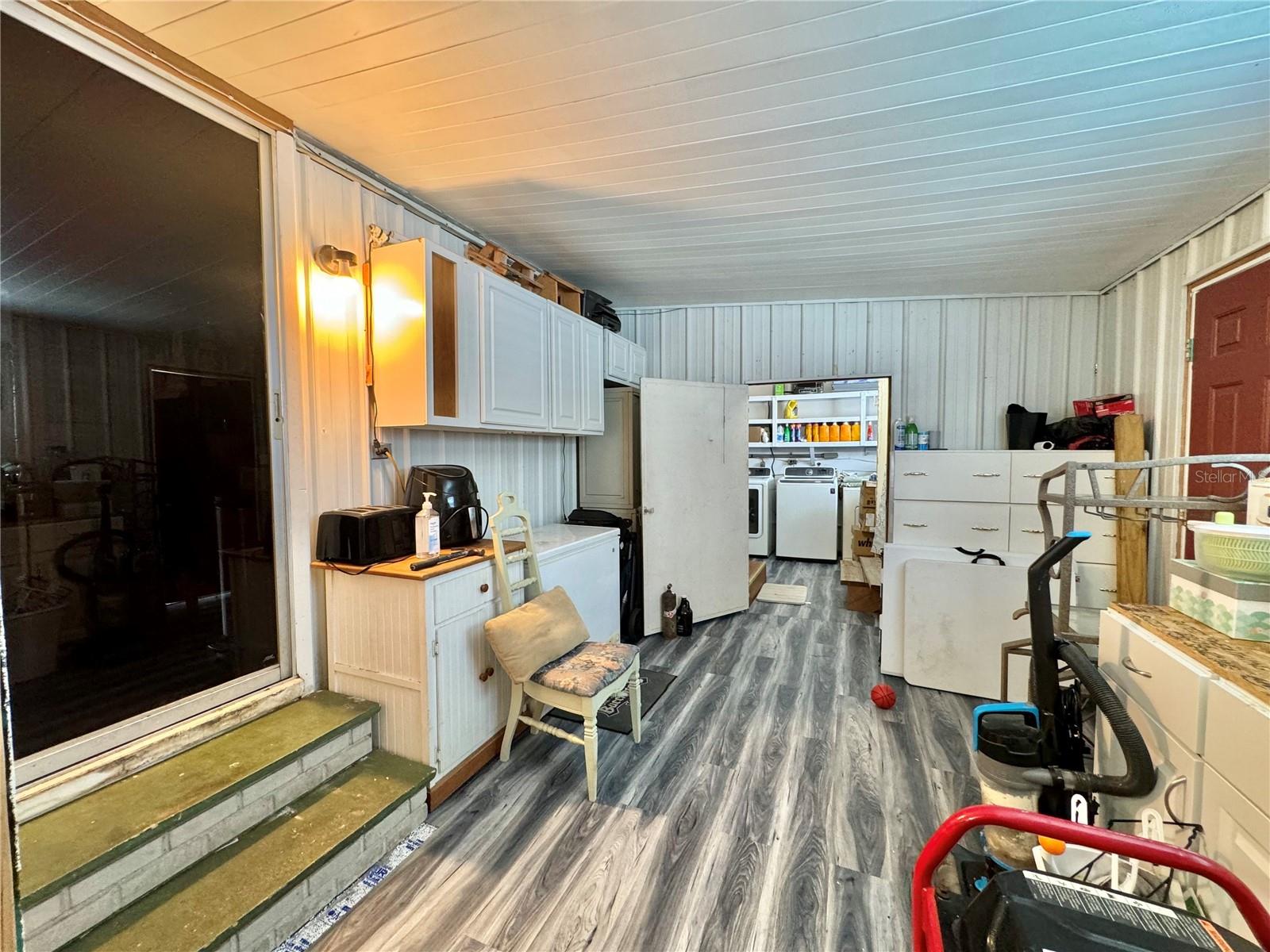 bonus room between garage and laundry room