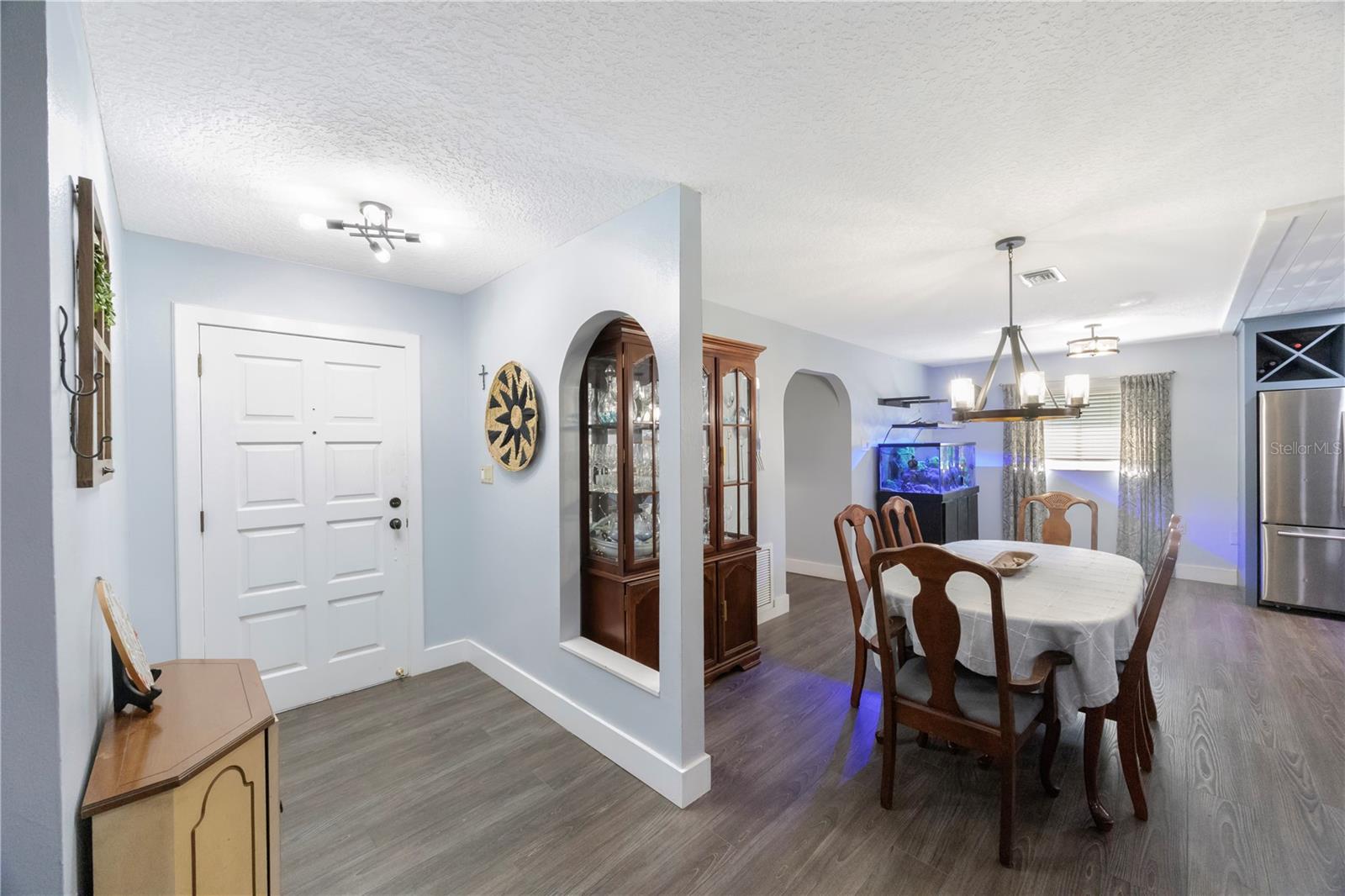 FRONT DOOR AND DINING AREA OFF OF GREAT ROOM