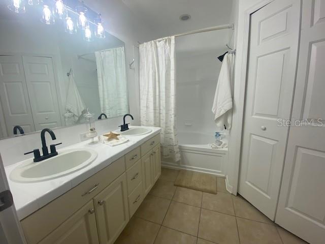 Primary bathroom en-suite has a full tub/shower combo,newly glazed, glazed double counter, 2 new sinks, new light fixture and faucets, walk in closet and toilet area. Lots of cabinets.