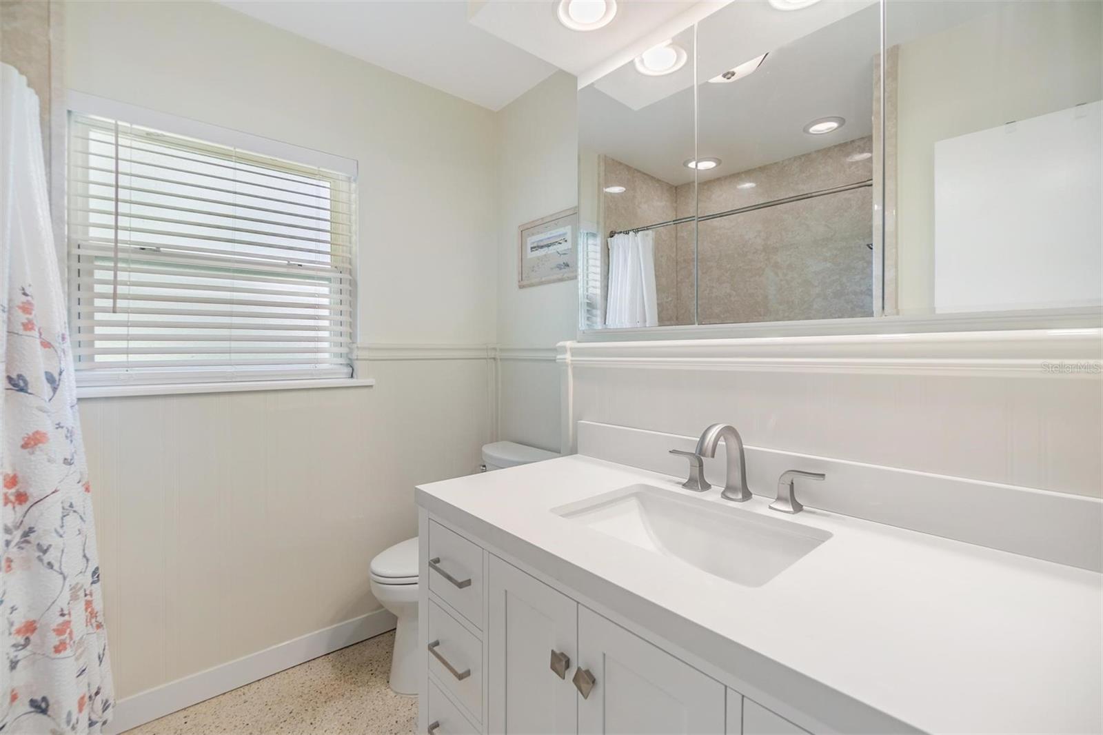 Completely remodeled guest bathroom with new vanity and Luxury Bath custom fitted Microban easy clean tub and wall surround.