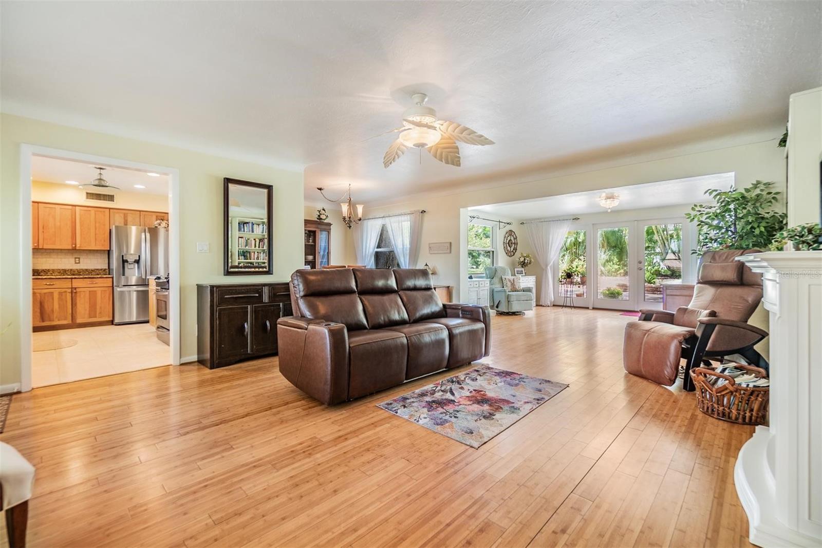 Light and bright with many windows, beautiful natural wood floors. decorator fans and light fixtures.