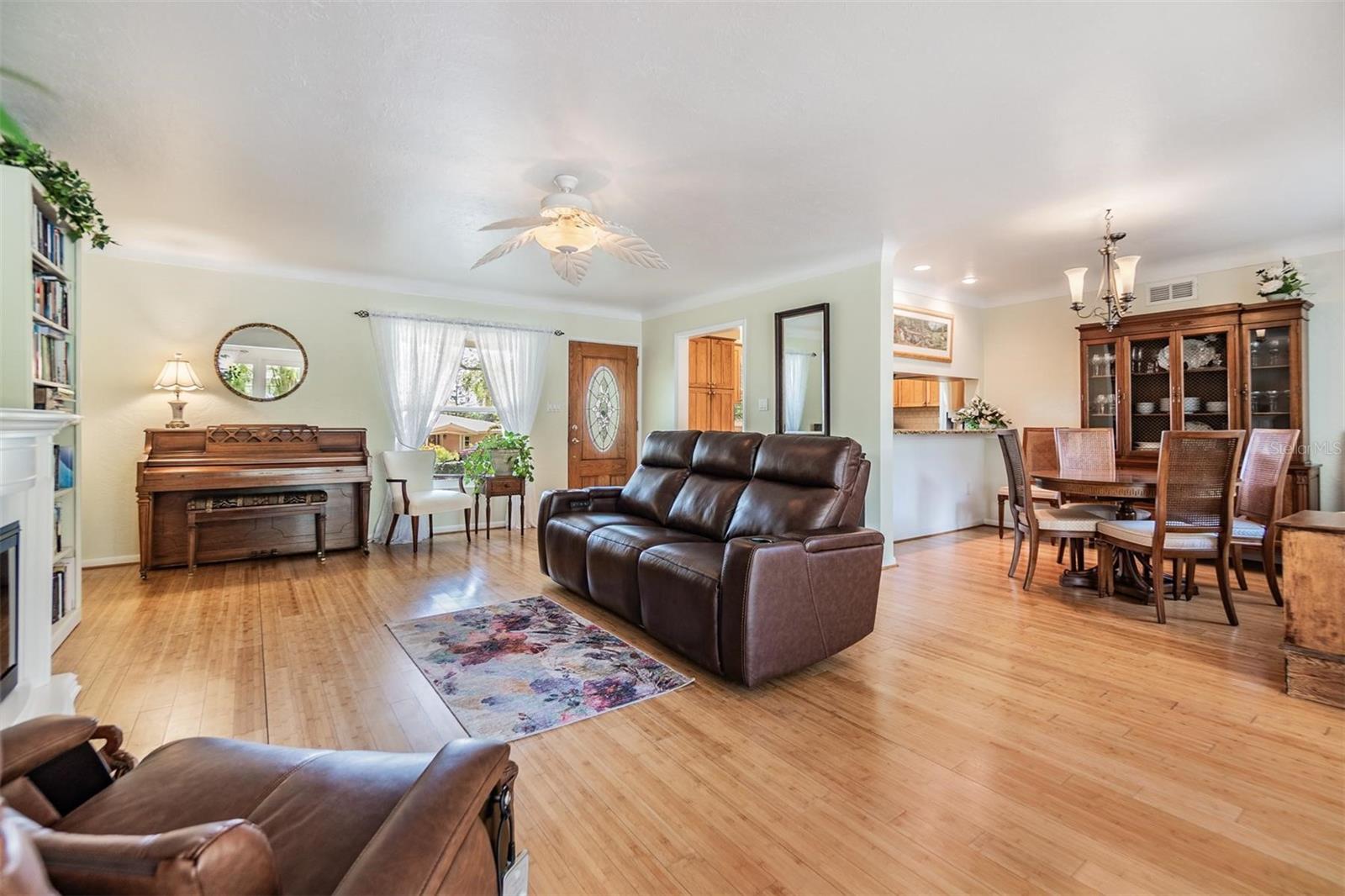 Living room flows easily into dining room. Pull up breakfast bar or serving area opens to kitchen.