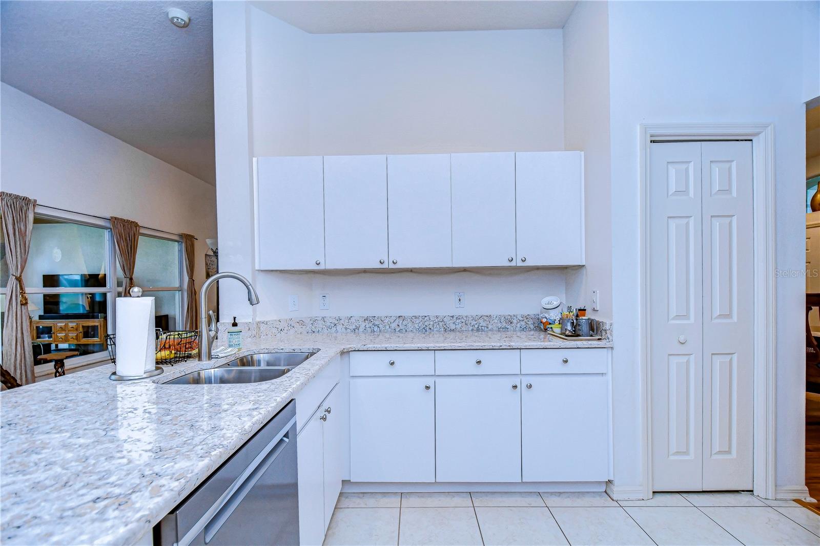 Kitchen features white cabinets!