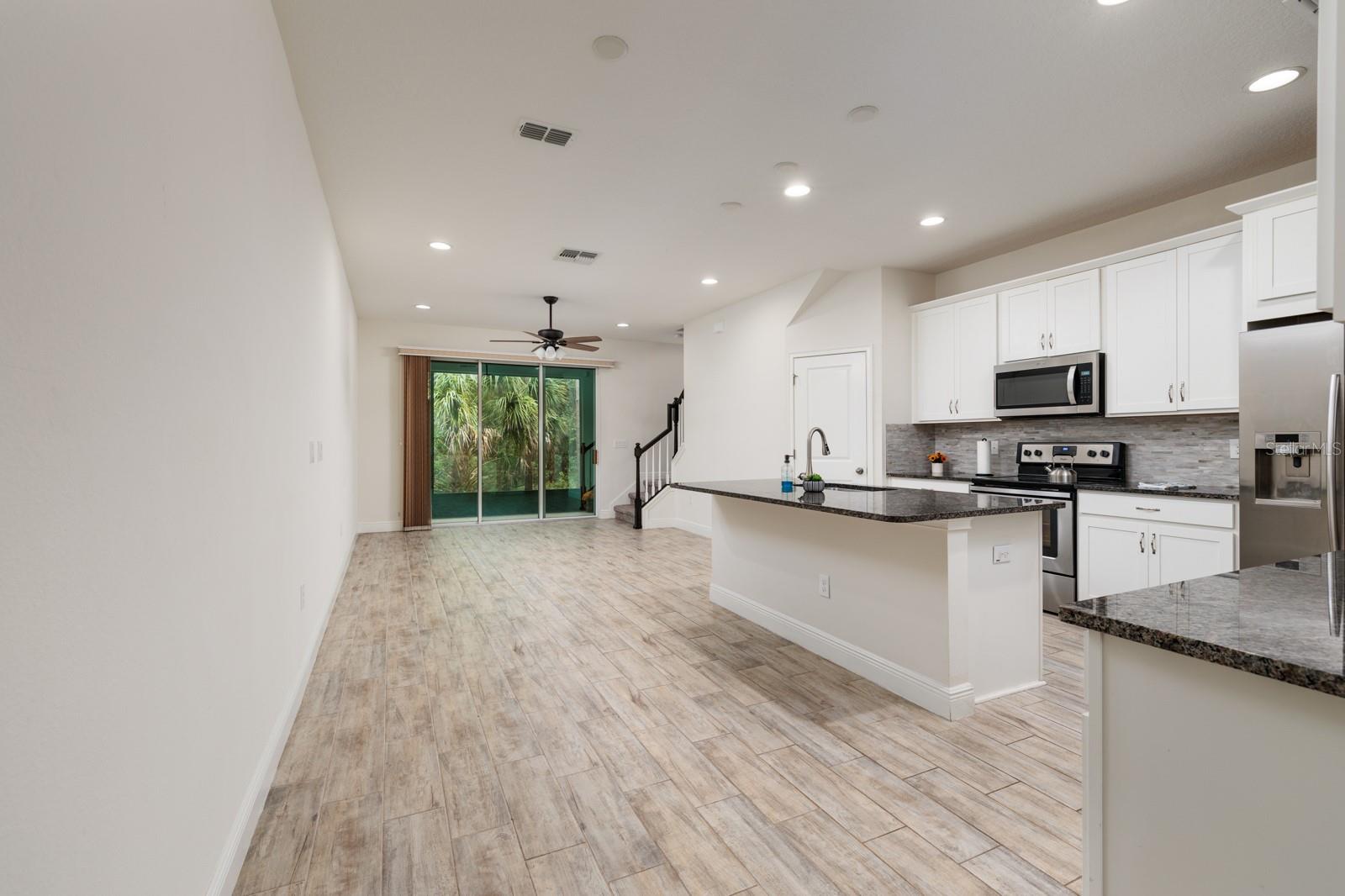 View from Foyer through Kitchen and Living Room