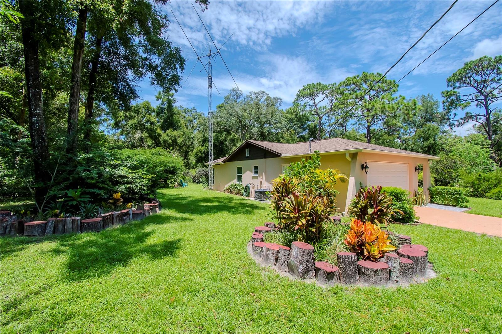 Side yard with tower in photo. Tower will not stay with property