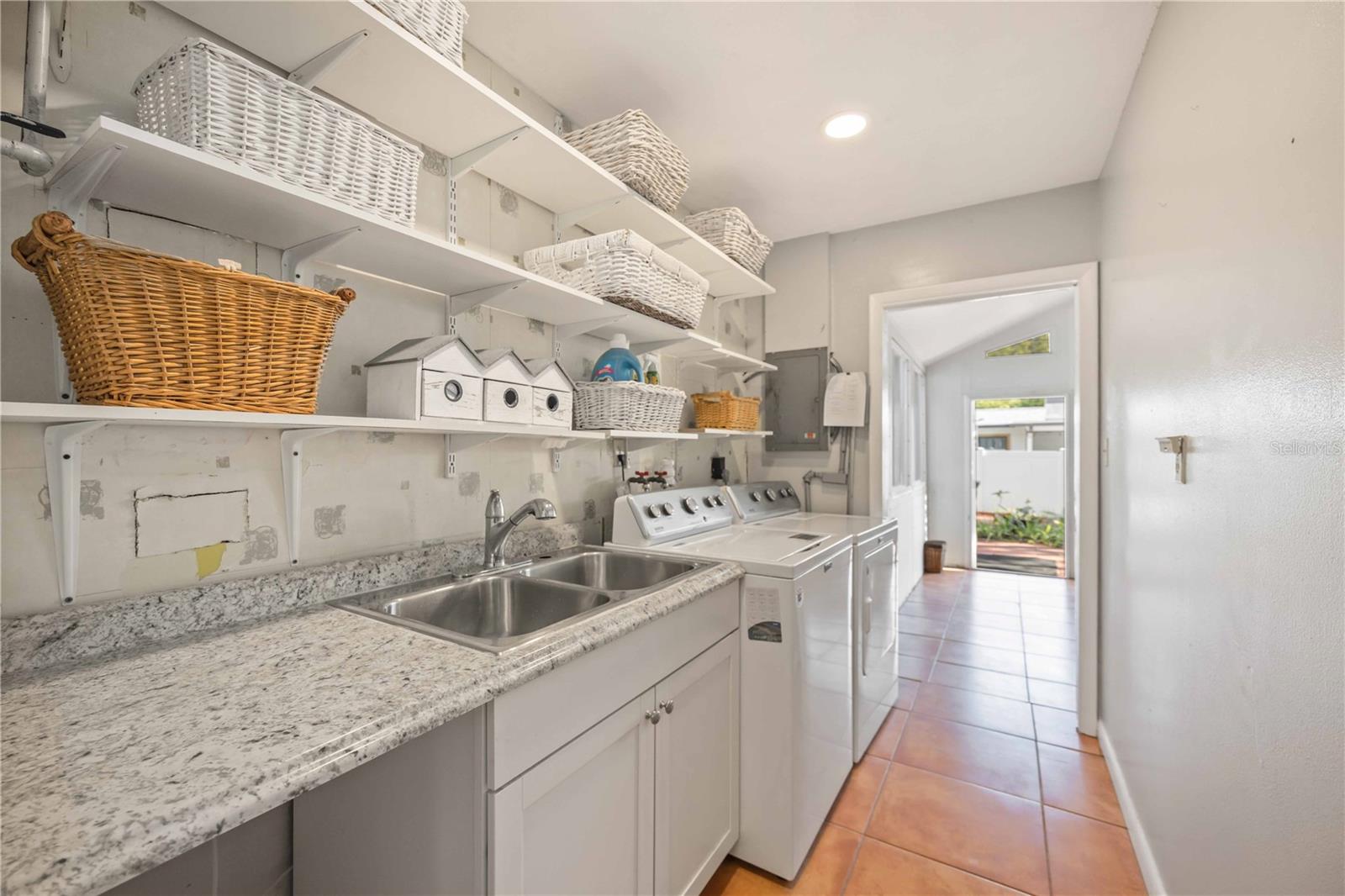 Yes!! An air-conditioned laundry room that is not in the garage!!