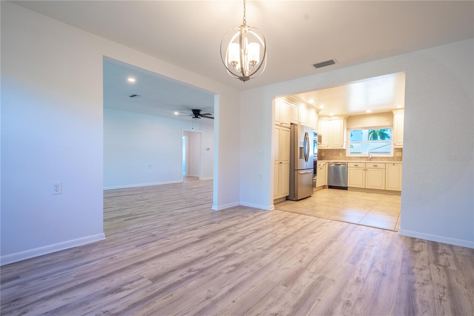 The dining room is open to both the living room and kitchen for ease of entertaining.