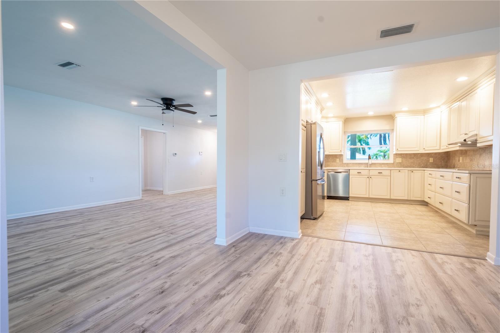 The open floor plan offers a bright and airy flow throughout the home, allowing for effortless transitions between spaces and abundant natural light.