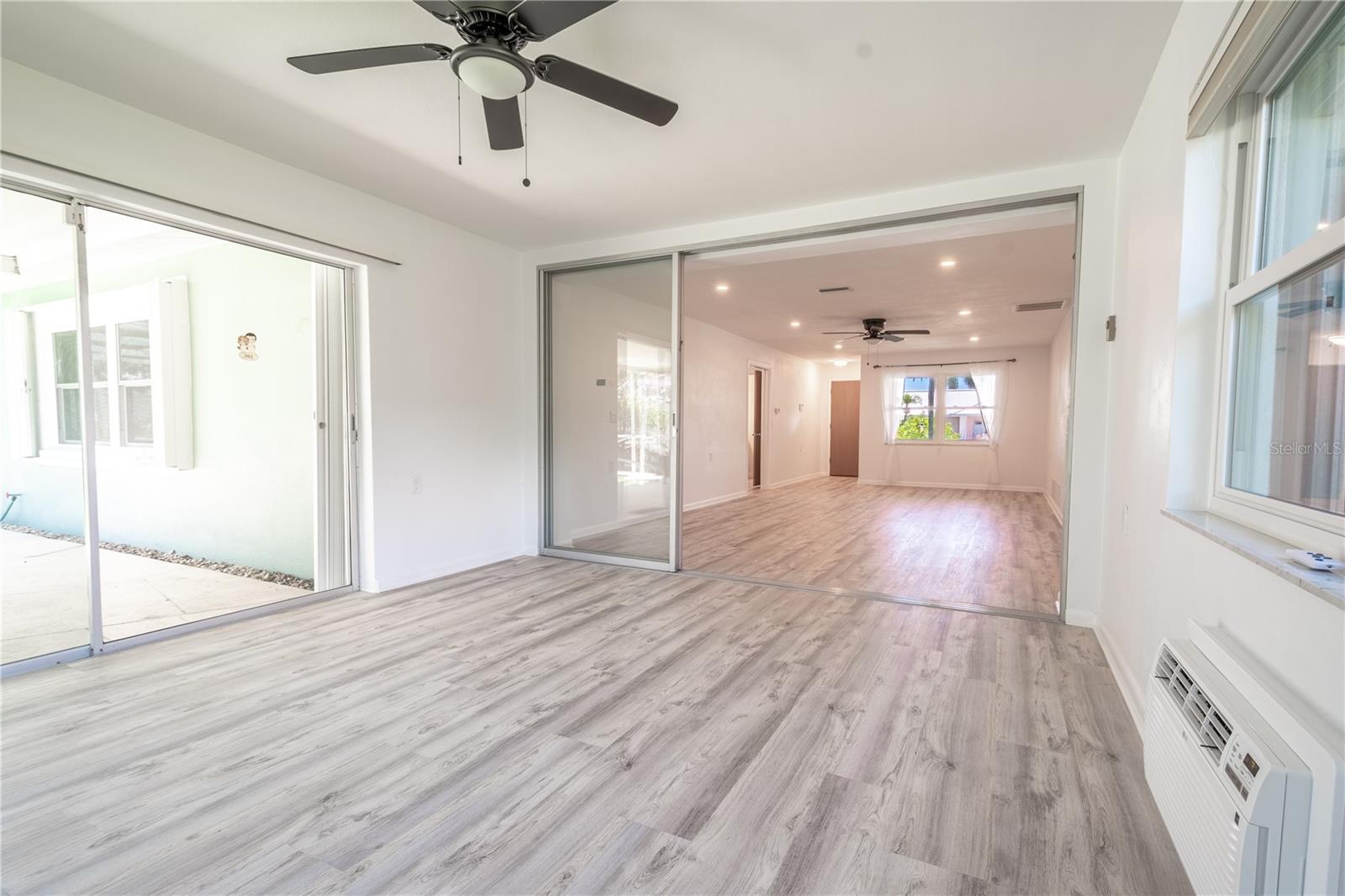 The Florida room opens to the living room and the screened-in lanai, creating a perfect blend of indoor and outdoor living.