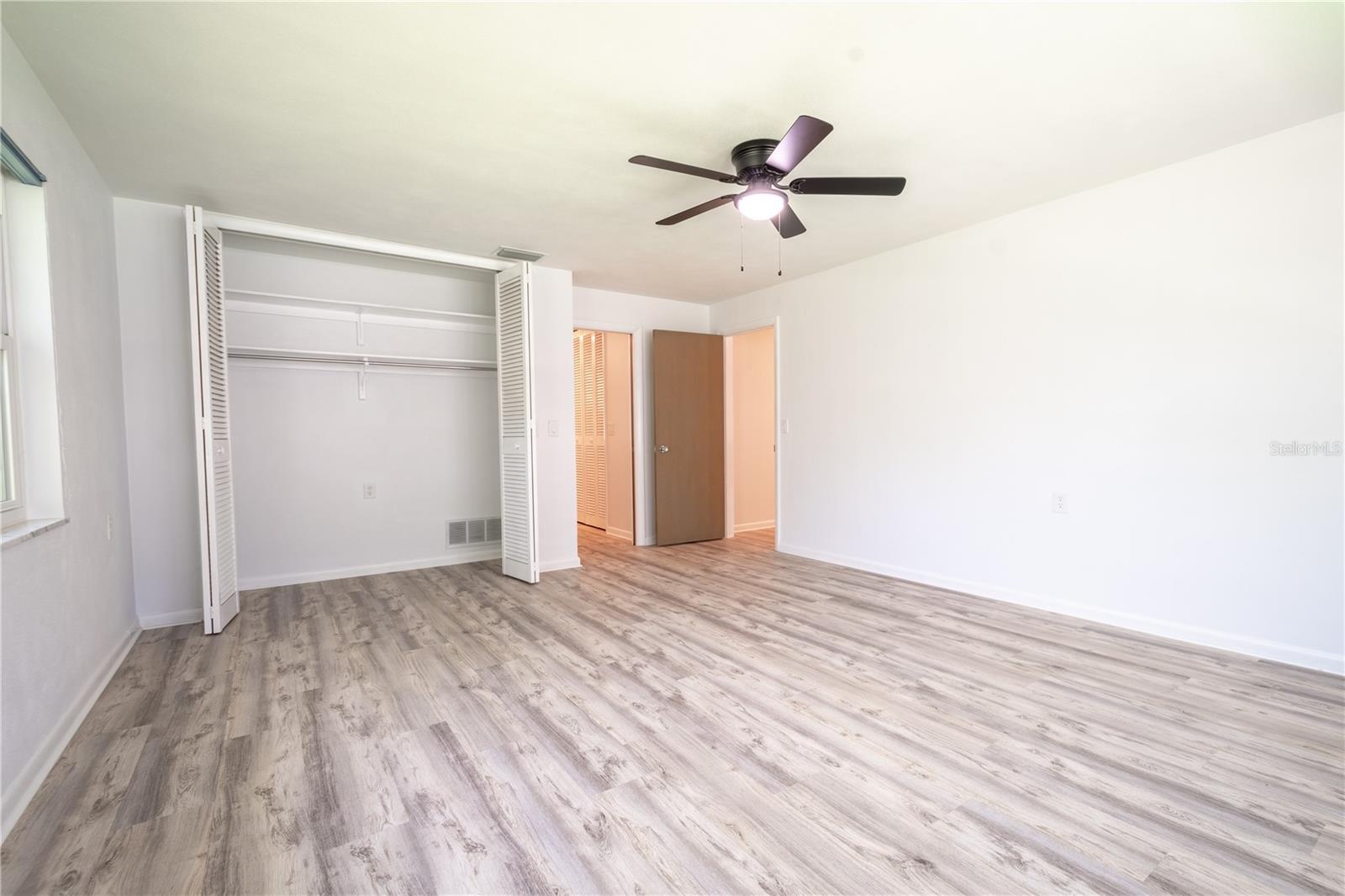 The primary bedroom features a built in closet and an ensuite bath.