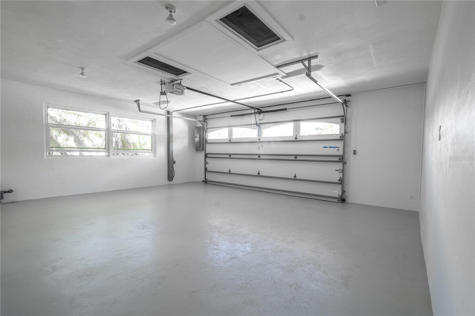 The two-car garage with window, features access to the attic and an electric garage door opener.