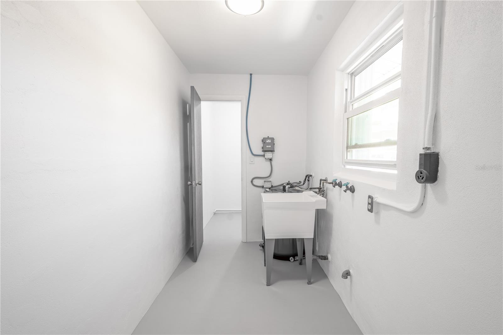 Laundry room can be accessed through the kitchen.