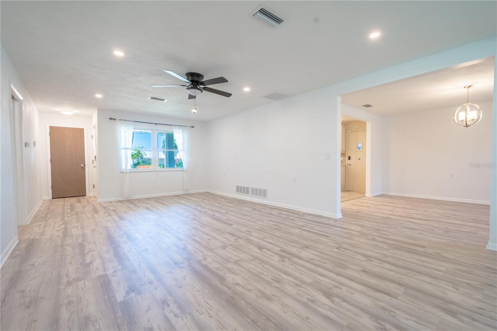 The living room flows effortlessly to the adjacent dining room.