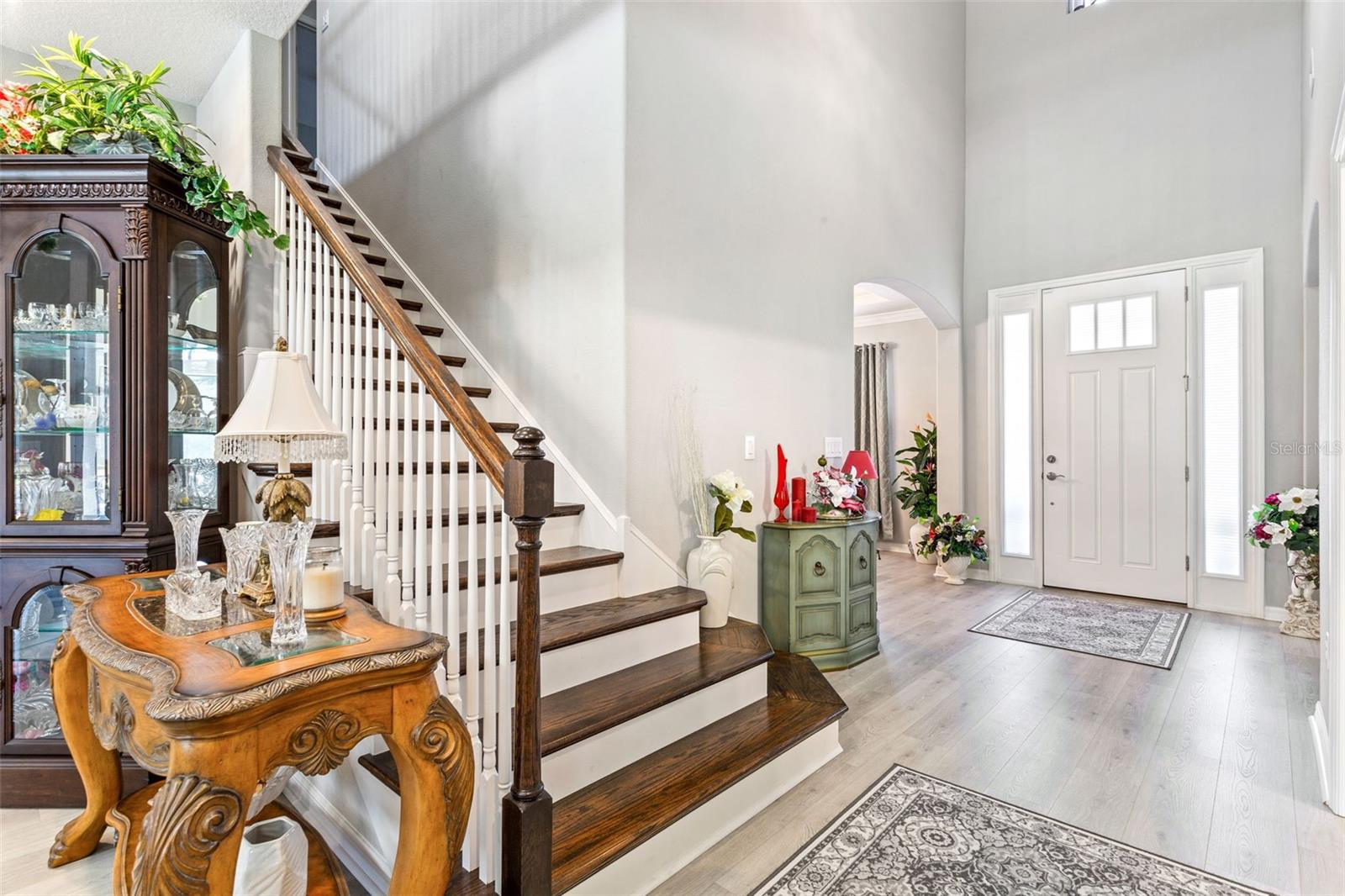 The staircase has exposed staircase & natural wood.