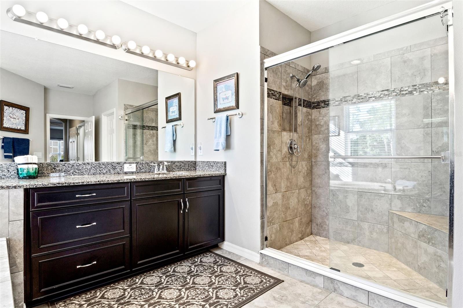 Bathroom has dual vanity areas/sinks, tons of room.