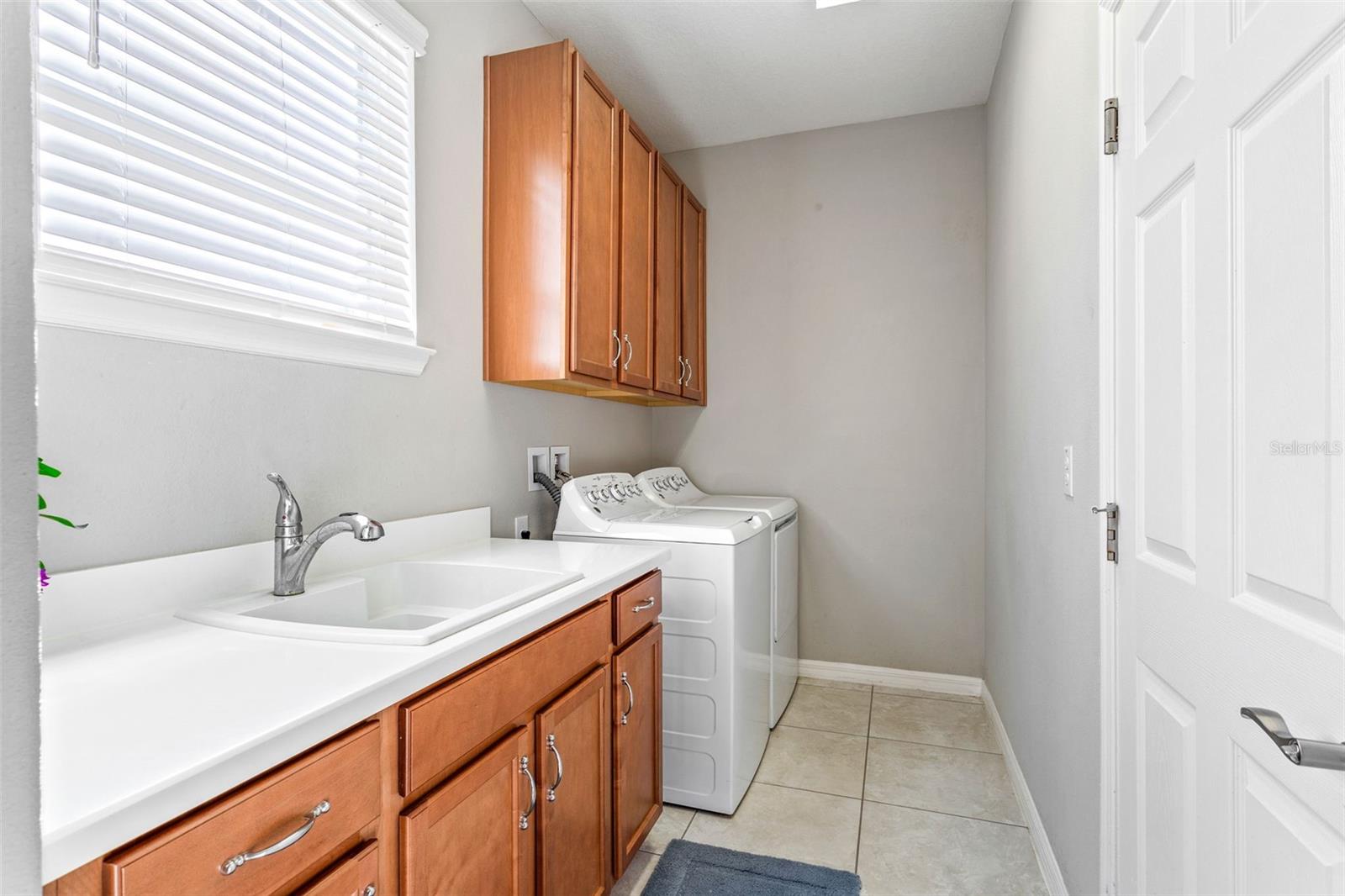 First floor laundry room with sink/prep area.